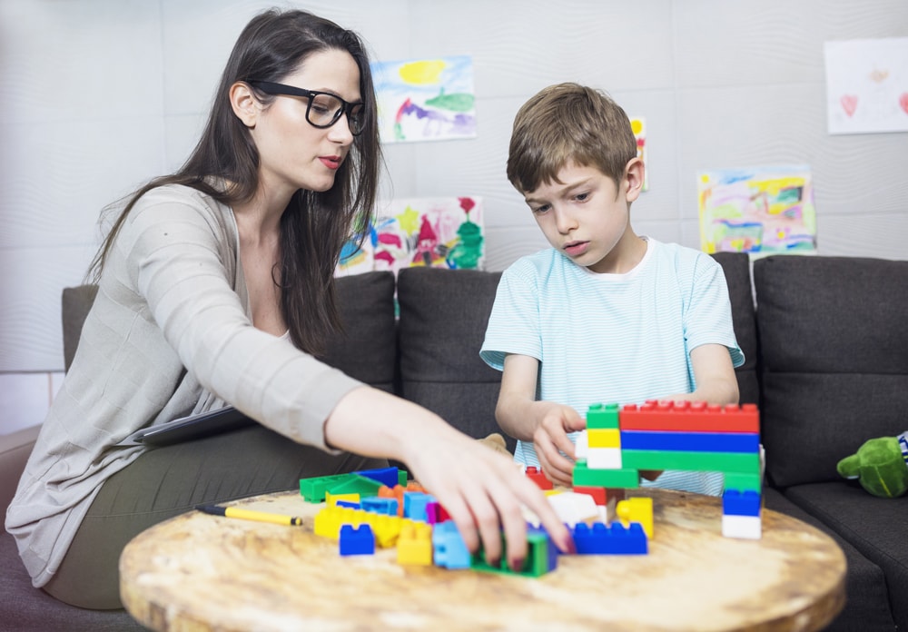 psycologist with child & legos copy-min